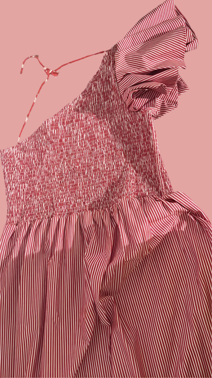 Close-up of a red and white striped dress with a smocked bodice.